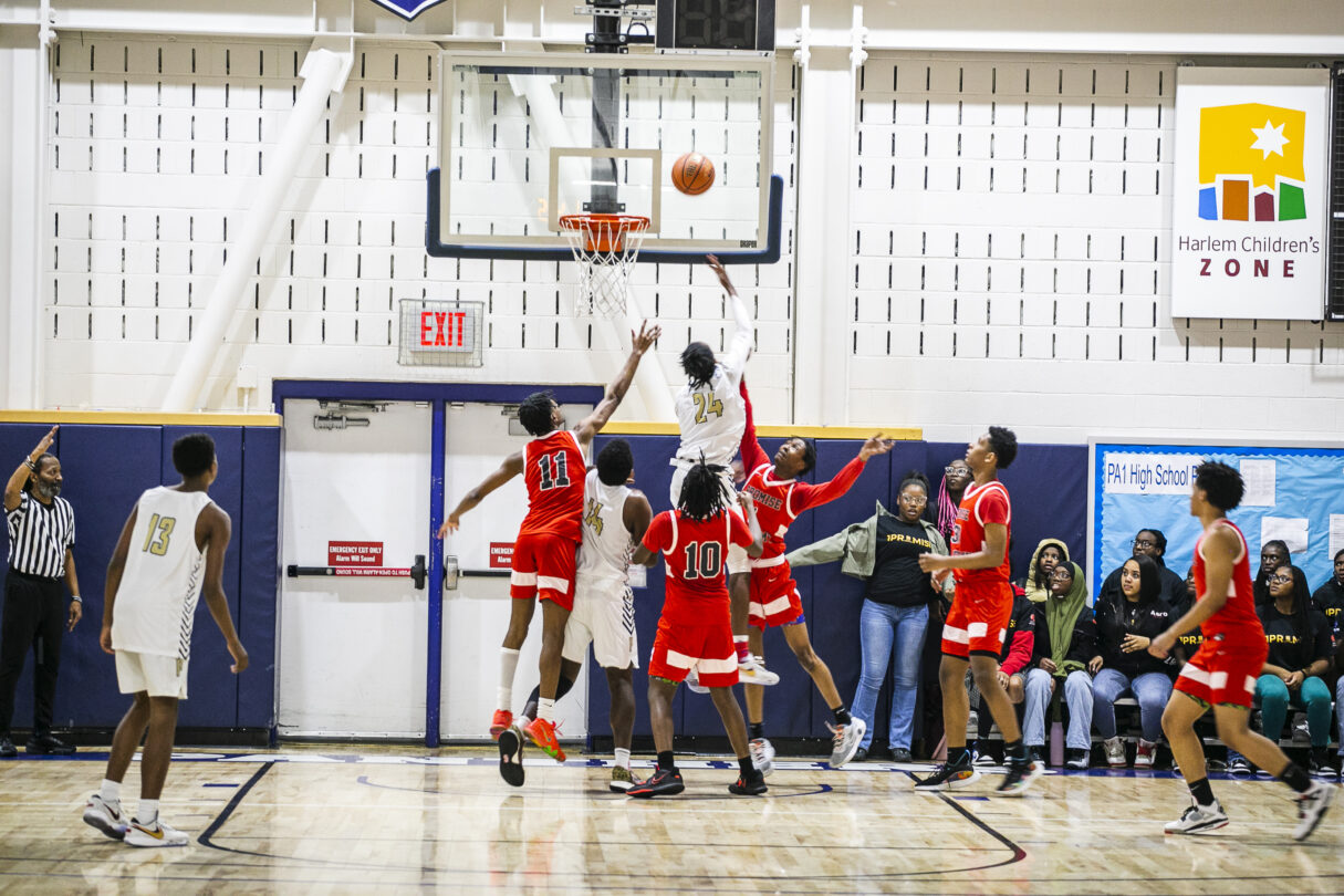 Scholars playing basktetball at Harlem Children's Zone Geoffrey Canada Community Center Gymnasium.