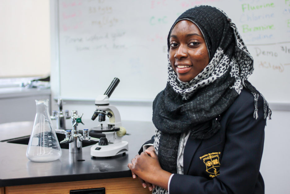 Student in blue jacket and headscarf