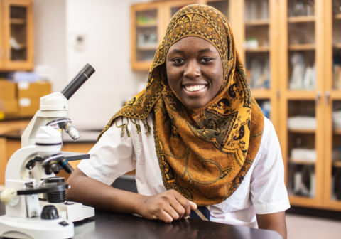 Student in orange head scarf