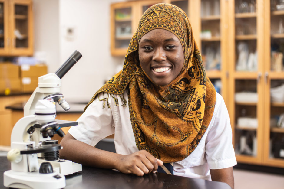 Student in orange head scarf