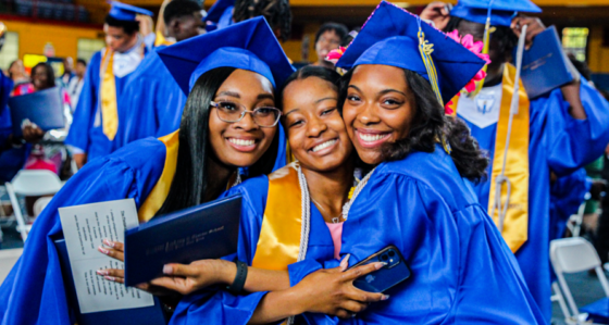 Promise Academy High School seniors smile during their graduation ceremonny during Graduation Week 2022
