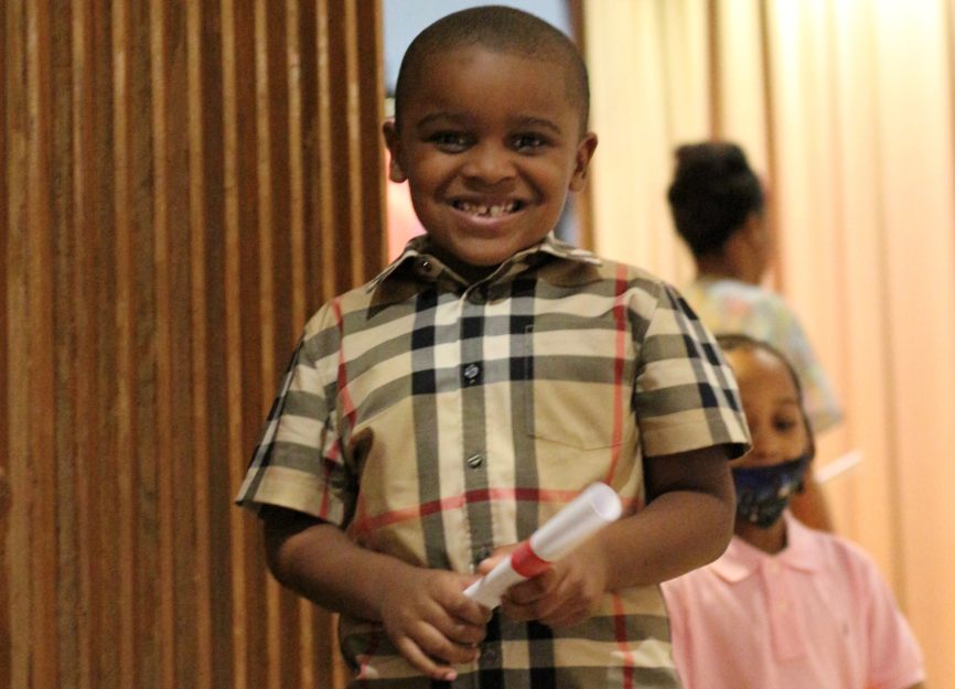 A Promise Academy II Kindergarten scholar at his graduation ceremony during Harlem Children's Zone Graduation Week 2022