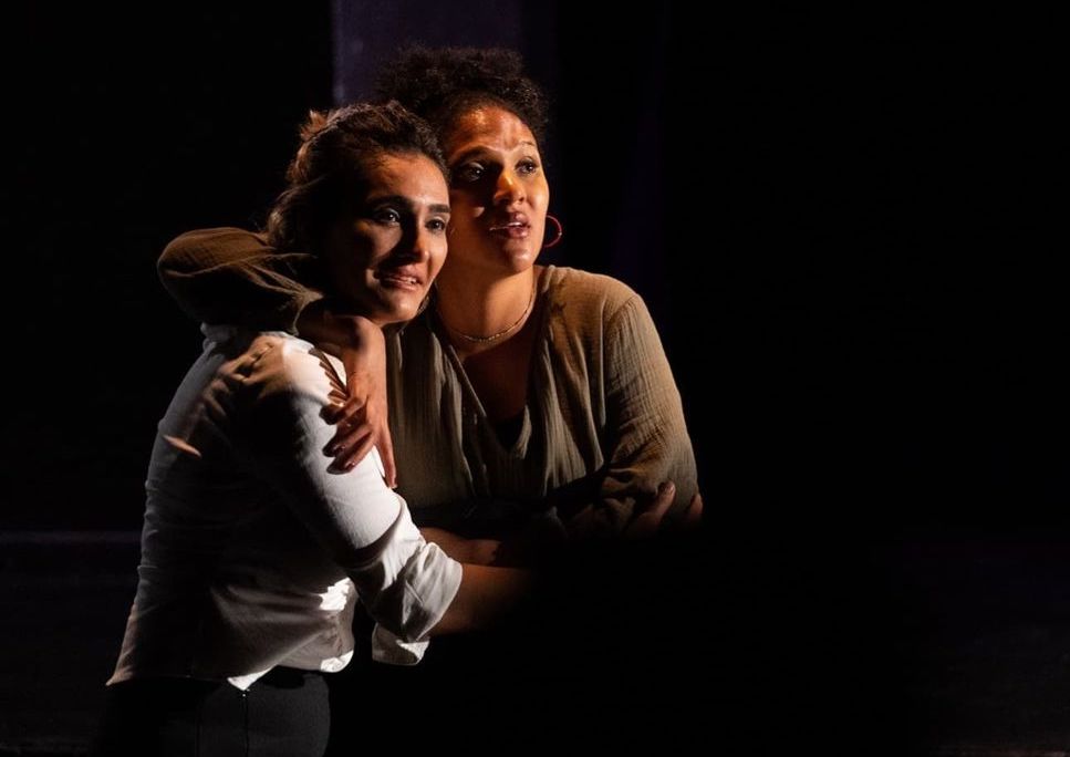 Reyna Bonaparte stars in a theater performance with a colleague.