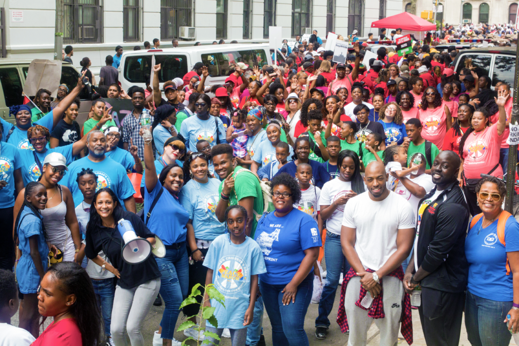A crowd of people outside attending the March for Peace.