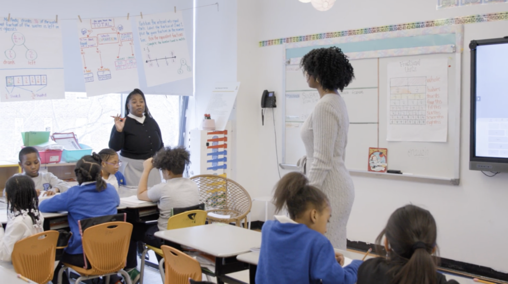 Janel Srother and Latasha Bryan work together in their classroom.