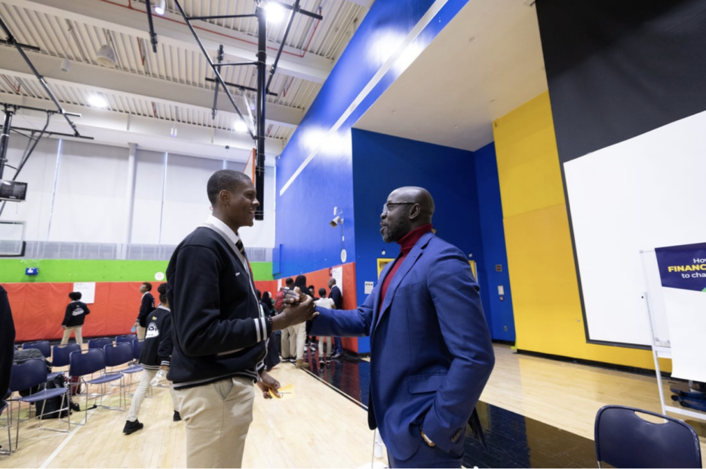 A student speaks to Kwame Owusu-Kesse.
